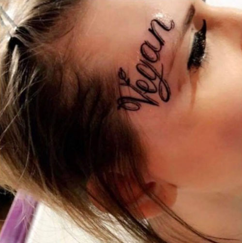 веганская татуировка на лице