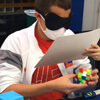 teenager solves a rubik's cube