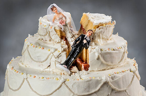 Groom throws cake in bride's face