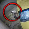 thief beaten under car