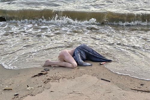 female corpse on the beach